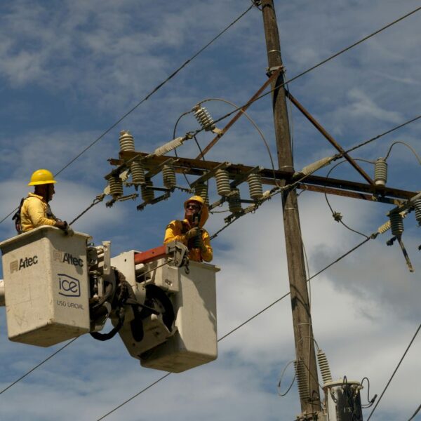 technicians repair power line