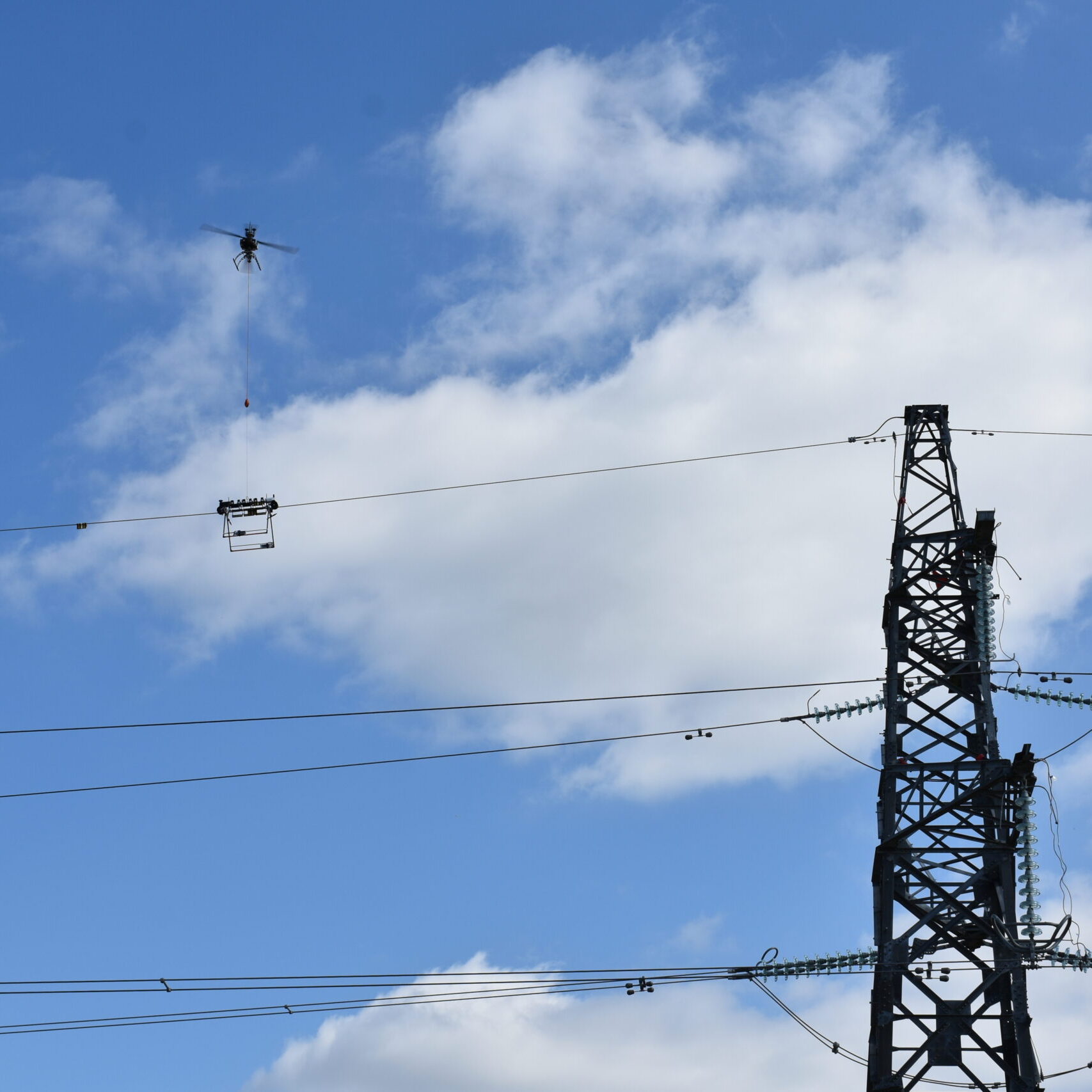 LineFly installing Hawk Eye BFD overhead wire